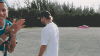 Man In White With Pink Car Parking Lot GIF