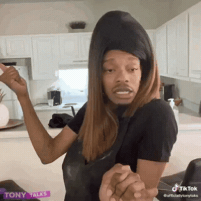 Man In Wig And Hat In Kitchen GIF