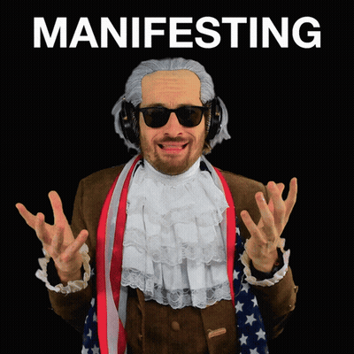 Man In Wig And Headphones Saying Manifesting GIF