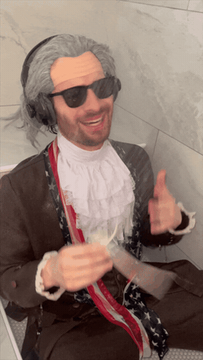 Man In Wig And Headphones Thumbs Up GIF