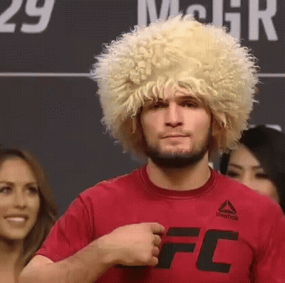 Man In Wig And Red Shirt Before Crowd GIF