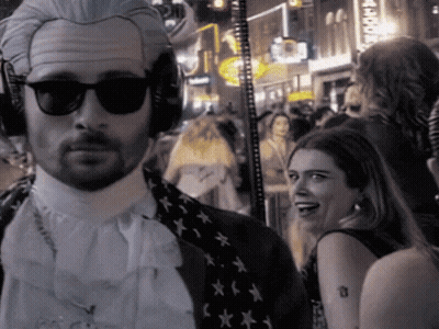 Man In Wig And Sunglasses Before Crowd GIF
