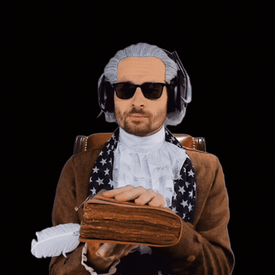 Man In Wig And Sunglasses Holding Book And Feather GIF