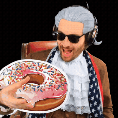 Man In Wig And Sunglasses Holding Donut With Sprinkles GIF