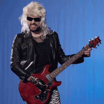 Man In Wig And Sunglasses Holding Guitar GIF