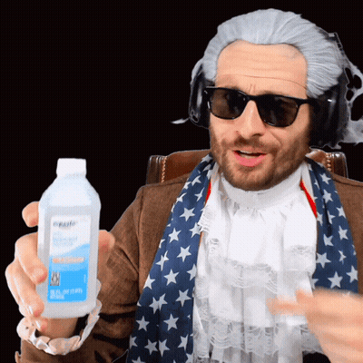 Man In Wig And Sunglasses Holding Hydrogen Peroxide GIF