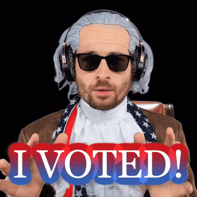Man In Wig And Sunglasses Holding I Voted Sign GIF