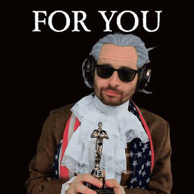 Man In Wig And Sunglasses Holding Oscar GIF