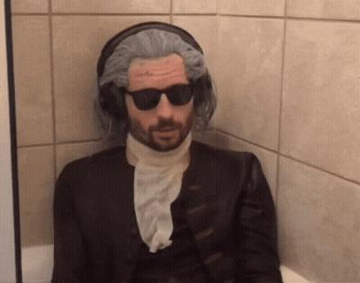 Man In Wig And Sunglasses In Bathroom GIF