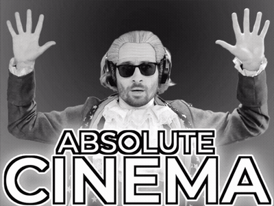 Man In Wig And Sunglasses In Front Of Absolute Cinema Sign GIF
