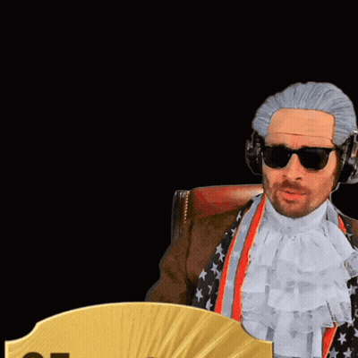 Man In Wig And Sunglasses Next To Card 85 Cdm GIF