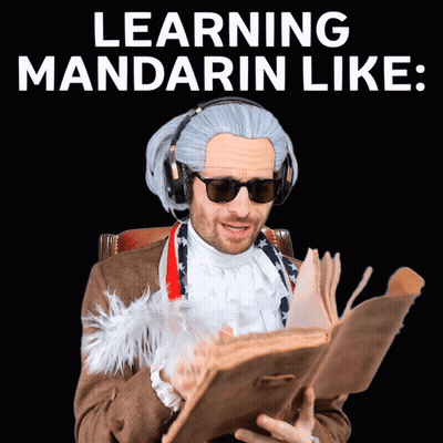 Man In Wig And Sunglasses Reading Book Learning Mandarin GIF