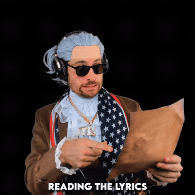 Man In Wig And Sunglasses Reading Song Lyrics GIF