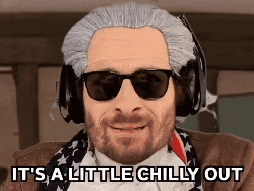 Man In Wig And Sunglasses Saying Its Chilly GIF