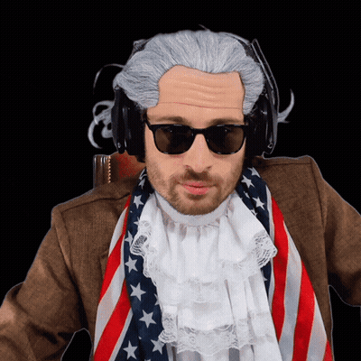 Man In Wig And Sunglasses With American Flag Scarf GIF
