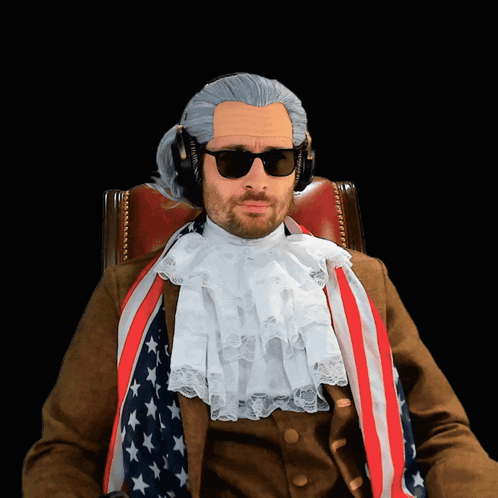 Man In Wig And Sunglasses With American Flag GIF