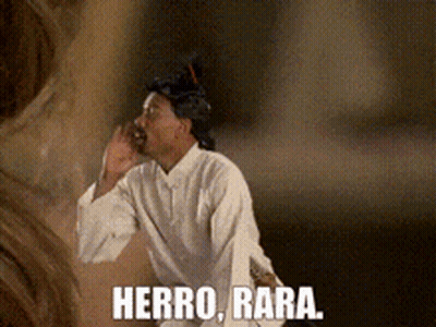 Man In Wig And White Shirt Says Herro Bara GIF