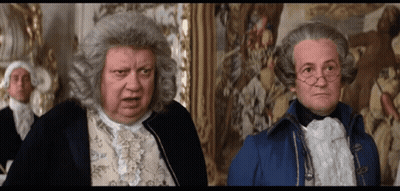 Man In Wig Next To Man In Blue Coat GIF