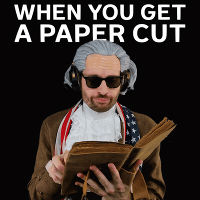 Man In Wig Reading 'When You Get A Paper Cut GIF