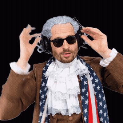 Man In Wig, Sunglasses, Headphones, American Flag Scarf GIF