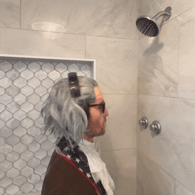 Man In Wig Taking Shower GIF