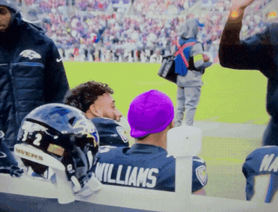 Man In Williams Jersey Sitting On Bench GIF