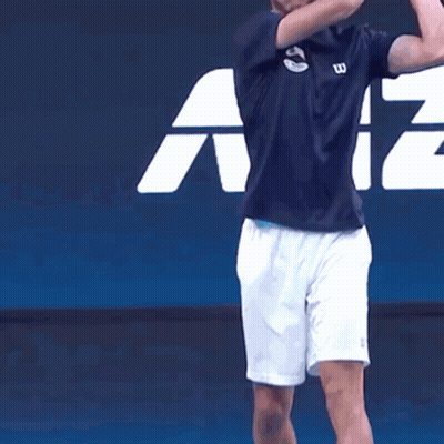Man In Wilson Shirt And White Shorts Playing Tennis GIF
