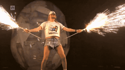 Man In Windows T-Shirt Holding Sparklers GIF