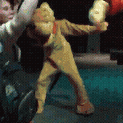 Man In Winnie The Pooh Costume Holding Stuffed Animal GIF