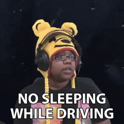 Man In Winnie The Pooh Hat And Headphones Making Funny Face While Driving GIF