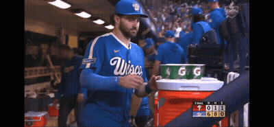 Man In Wisconsin Baseball Uniform Holding Cooler GIF