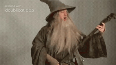Man In Wizard Costume Holding Guitar GIF