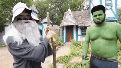 Man In Wizard Costume Next To Green Orc GIF