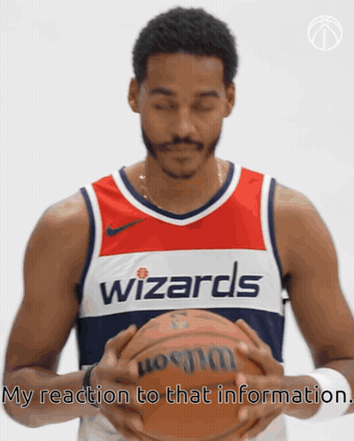 Man In Wizards Jersey Holding Basketball GIF