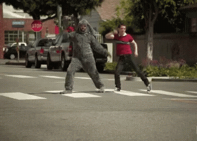 Man In Wolf Costume Crossing Street GIF