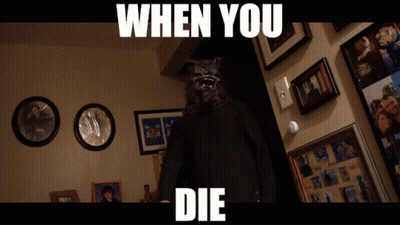 Man In Wolf Mask In Front Of Wall With Pictures Saying When You Die GIF