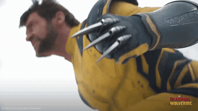 Man In Wolverine Costume Flying GIF