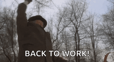 Man In Woods With Fist In Air Saying Back To Work GIF