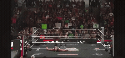 Man In Wrestling Ring Holding I Love You Sign GIF