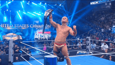 Man In Wrestling Ring Holding US Champion Belt GIF