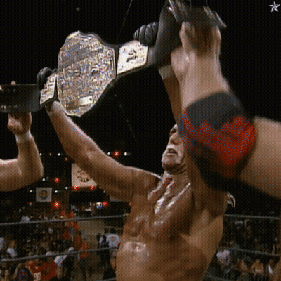 Man In Wrestling Ring Holding World Heavyweight Champion Belt GIF