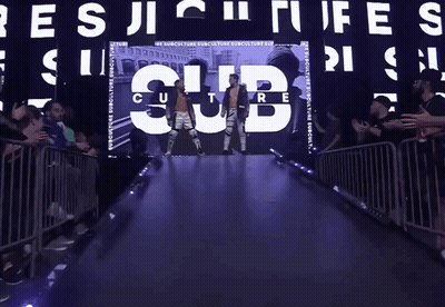 Man In Wrestling Ring Surrounded By Collage GIF