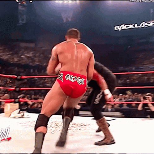 Man In Wrestling Ring Wearing Red Shorts Saying Orion GIF