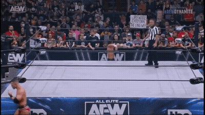 Man In Wrestling Ring With AEW Dynamite Sign GIF