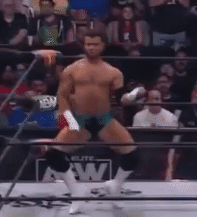 Man In Wrestling Ring With AEW On Shirt GIF