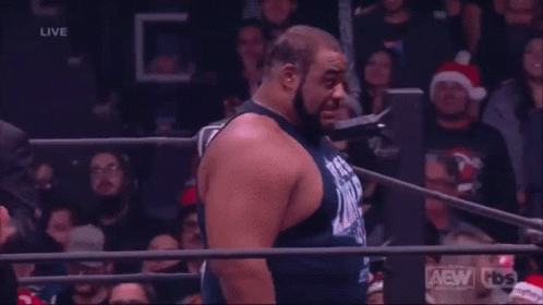 Man In Wrestling Ring With AEW Shirt GIF