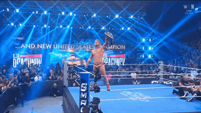 Man In Wrestling Ring With And New United States On Wall GIF