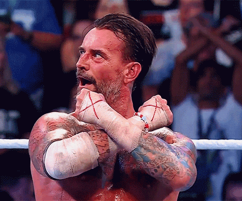 Man In Wrestling Ring With Arms Crossed And Bracelet GIF