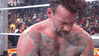 Man In Wrestling Ring With Chest Tattoo GIF