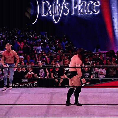 Man In Wrestling Ring With Daily's Place Sign GIF